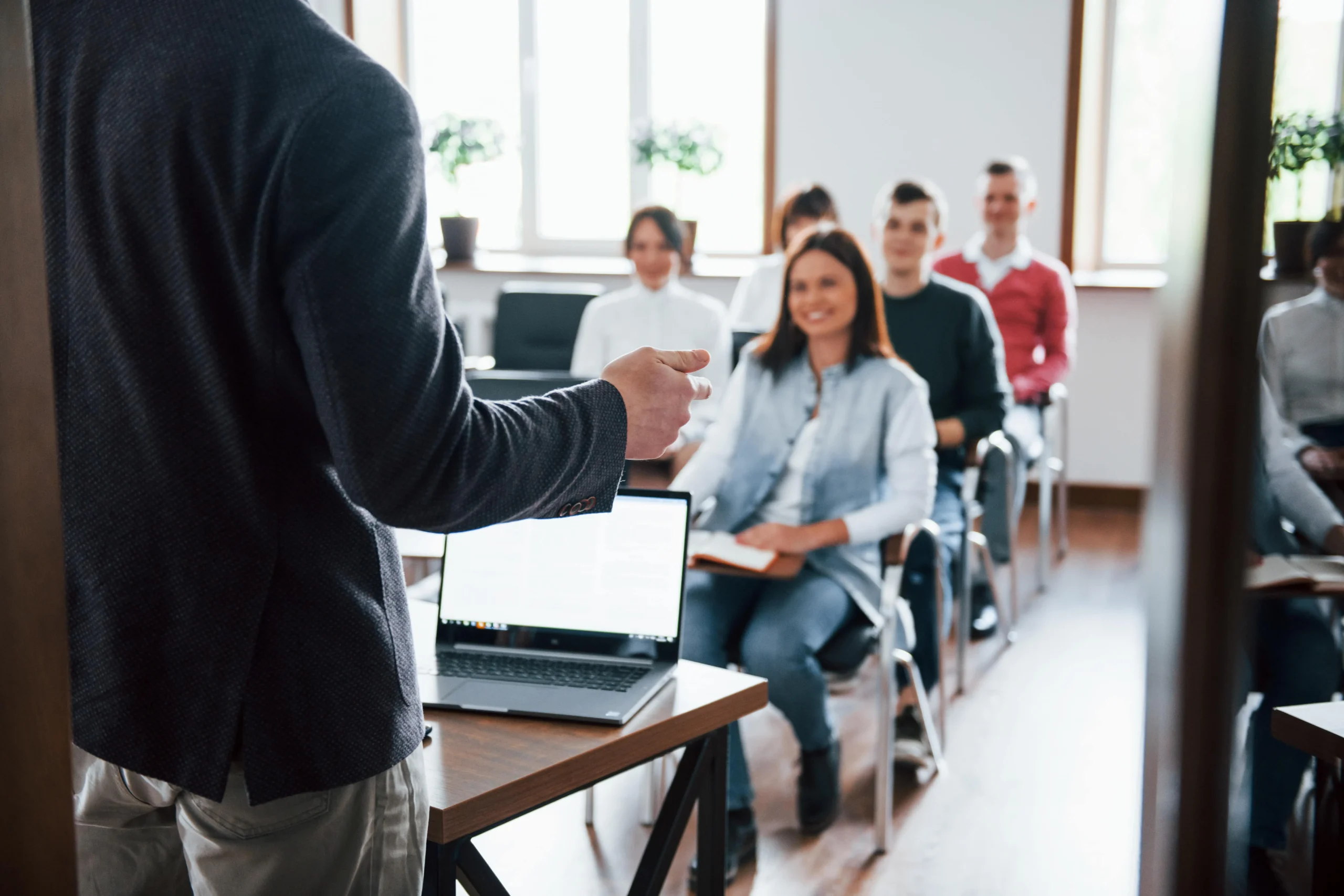 A professional CTPAT training provider leading a CTPAT security awareness program for a group of employees in a modern conference room.